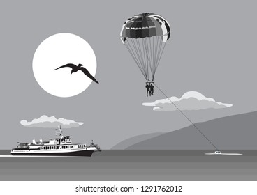 Parachute over the sea. Outdoor activities over the sea and mountains.