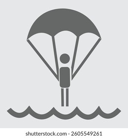 Parachuting over water, featuring thrilling skydiving action and scenic landscape.