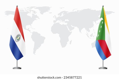 Paraguay and Comoros flags for official meeting against background of world map.