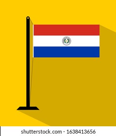 paraguay flag on pole, isolated on yellow background