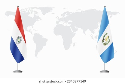 Paraguay and Guatemala flags for official meeting against background of world map.