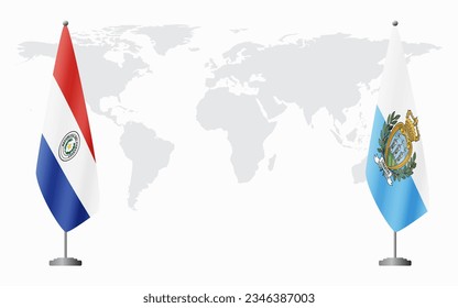 Paraguay and San Marino flags for official meeting against background of world map.