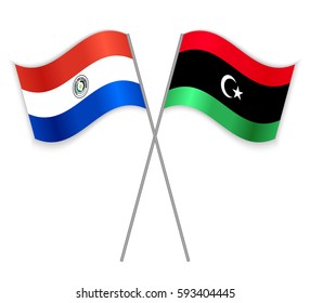 Paraguayan and Libyan crossed flags. Paraguay combined with Libya isolated on white. Language learning, international business or travel concept.
