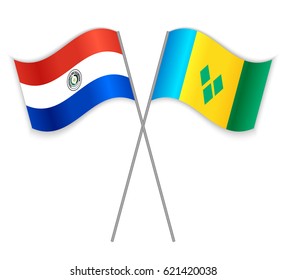 Paraguayan and Vincentian crossed flags. Paraguay combined with Saint Vincent and the Grenadines isolated on white. Language learning, international business or travel concept.