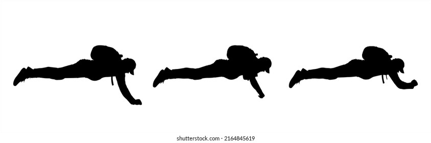 Paratroopers. A parachute jump that hasn't opened yet. Men in tracksuits, with backpacks on their backs and sneakers on their feet, in a lying position. Guys of large physique lie belly down.	