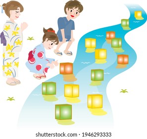 Parent and child doing floating of lanterns on the Bon festival