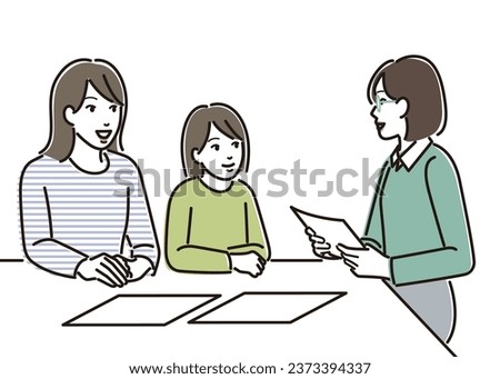 Parent and child receiving explanation from teacher