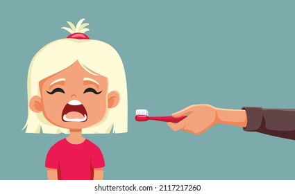 
Parent Holding a Toothbrush Explaining his Daughter Dental Care. Adult teaching little child about dental health supervising teeth brushing 
