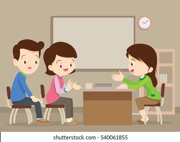 Parent Meeting With Teacher In Classroom.School Principal Talking To Father And Mother.