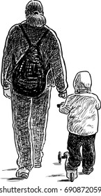 A parent walks with his kid