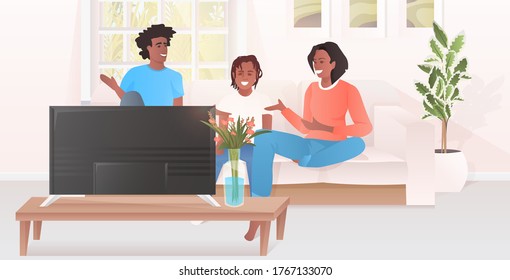parents with little daughter watching tv show family sitting on couch spending time together modern living room interior horizontal full length vector illustration