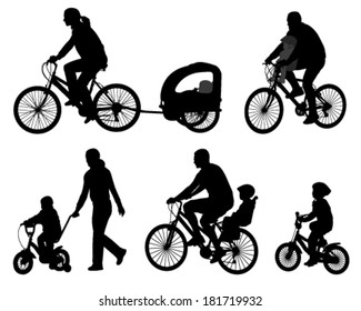 parents riding bicycles with their kids silhouettes