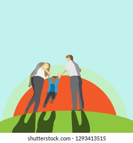 Parents and son hold hands to walk the grass.