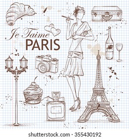 paris set on note book page with Eiffel Tower, perfume, cake, wine