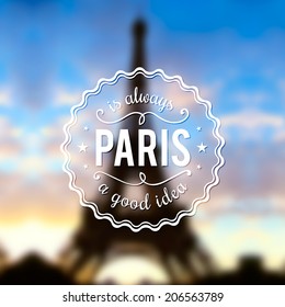 Paris typographic design on blurred Eiffel tower background