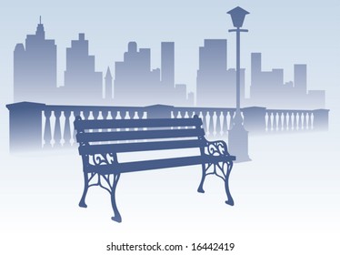 Park bench on the city background
