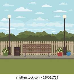 park scene with bench, street lights, grass and flowers