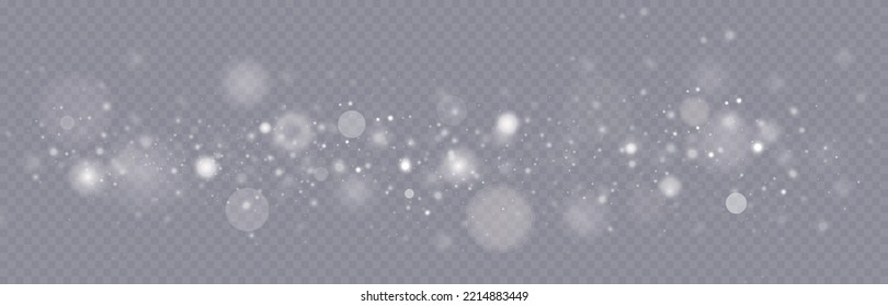 Particles of white magic dust. Shining light particles.Christmas glitter particles. Light effect on a transparent background.
