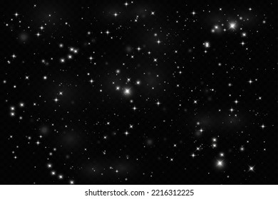 Particles of white magic dust. Shining light particles.Christmas glitter particles. Light effect on a transparent background.