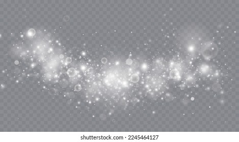 Particles of white magic dust. Shining light particles.Christmas glitter particles. Light effect on a transparent background
