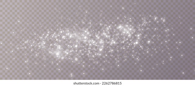 Particles of white magic dust. Shining light particles.Christmas glitter particles. Light effect on a transparent background