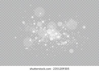 Particles of white magic dust. Shining light particles.Christmas glitter particles. Light effect on a transparent background