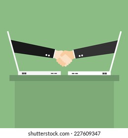 Partnership handshake to business success Online via laptop