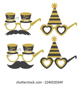Party glasses and greetings decorated with a hat and stars, ready to be used in New Year's Eve party.