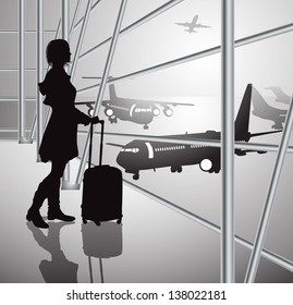 passenger with luggage in airport, black-white