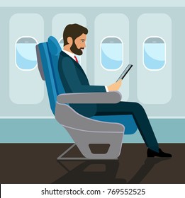 Passenger man  sitting in chair and  using tablet in airplane. Vector flat style illustration