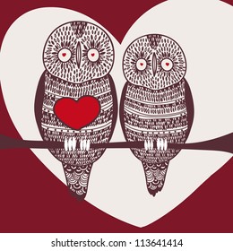 passion owls on tree branch in love