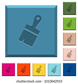 Paste with brush engraved icons on edged square buttons in various trendy colors