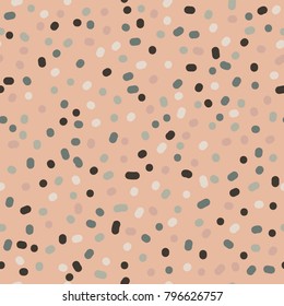 Pastel colored blob misshapen polka dot confetti background, in colors of beige, brown greens and grays. Seamless repeating pattern