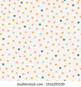 Pastel confetti seamless pattern. Hand-drawn polka dot texture background. Neutral abstract print in yellow, blue and pink on off-white background.