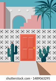 Pastel modern mid century building faced with red door and cactus coconut trees