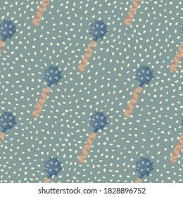 Pastel palette seamless doodle pattern with stylized flail mace shapes. Blue and beige colored weapon on green dotted background. For fabric design, textile, wrapping, cover. Vector illustration.