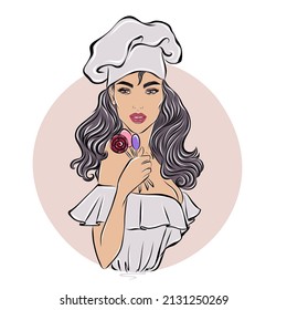 The pastry chef is holding lollipops. The girl in the chef's cap. An avatar for a business card or for social networks. 