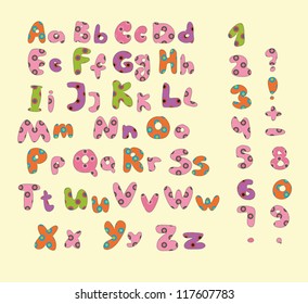 patchwork alphabet in different colors on creamy background