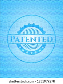 Patented light blue water emblem background.