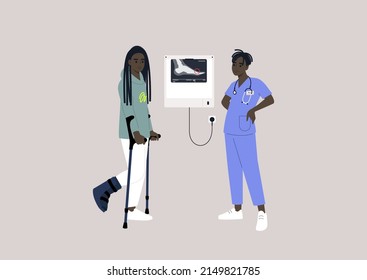 A patient with a bone fracture using crotches on a checkup appointment with a doctor, an x-ray light box on the wall