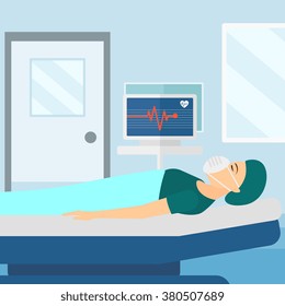 Patient lying in hospital bed with heart monitor.