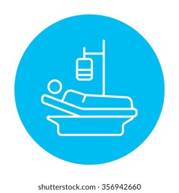 Patient lying on the bed with drop counter line icon for web, mobile and infographics. Vector white icon on the light blue circle isolated on white background.