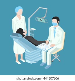 Patient at a reception at the dentist. A doctor in a respirator. Nurse standing next to the dental chair.
