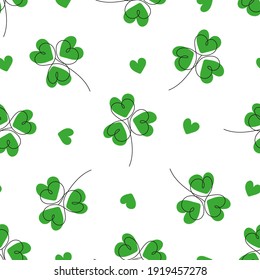 Patrick Day pattern with hearts and green leafs of clover on white background. Vector seamless pattern