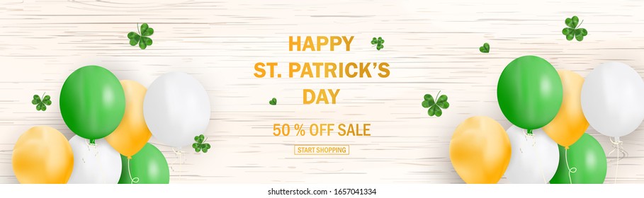 Patrick's day sale banner template with shamrock leaves on wooden background. Banner 50 % off for the St. Patrick's day. Shop market poster for site, newspaper, magazine, promotions, websites.