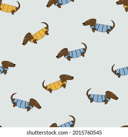 Patten with dachshunds in yellow and blue pullovers