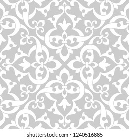 Pattern. Abstract floral seamless background with stylized leaves and scrolls forming ornament in Arabesque style. 