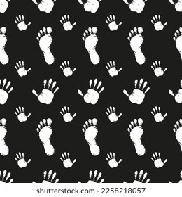 Pattern black prints of palms and feet on a black background.