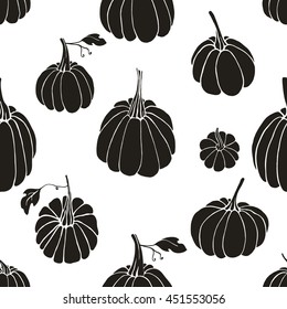 Pattern with black pumpkins on white background. Design element for wrapping paper, textile. Autumn collection.