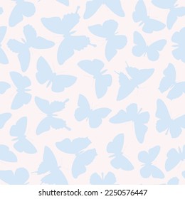 Pattern of blue butterflies on a milky background in a flat style for printing and decoration. Vector illustration.